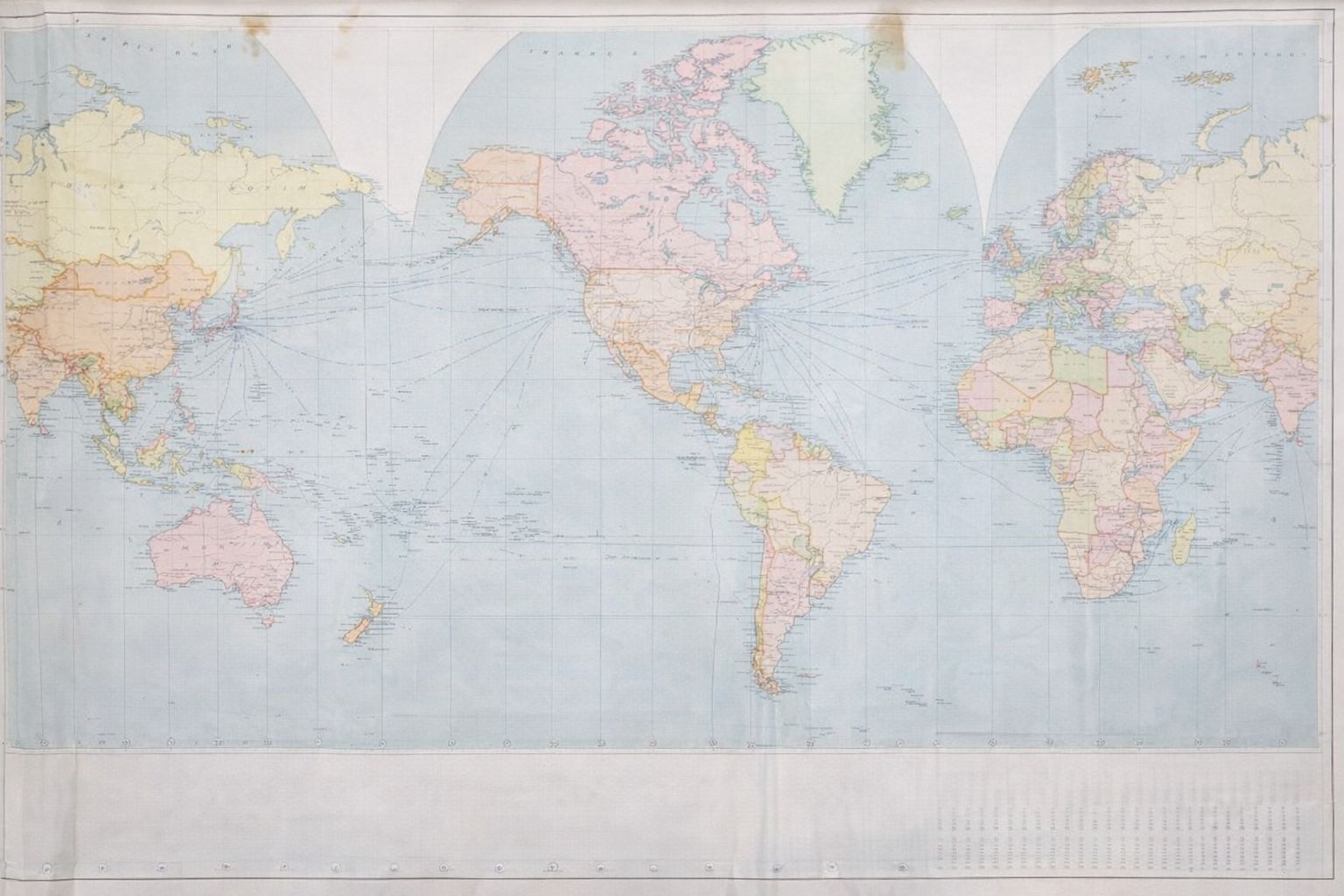 Vanha maailmankartta, joka esittää globaaleja kauppareittejä ja aikavyöhykkeitä.